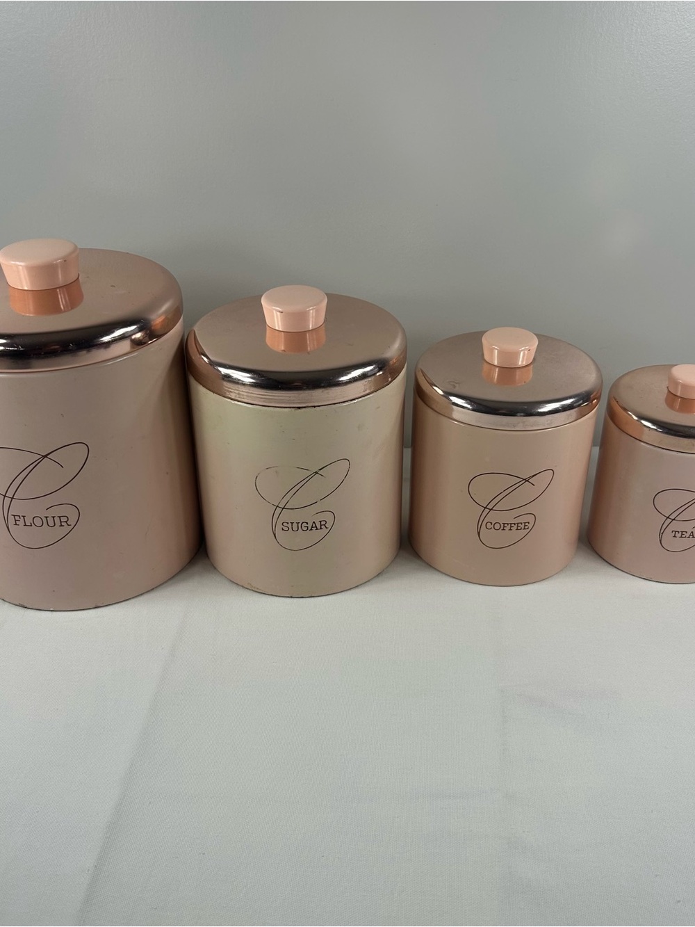 Vintage Ransburg Indianapolis 4-Piece Nesting Canister Set Pink & Copper MCM Tin